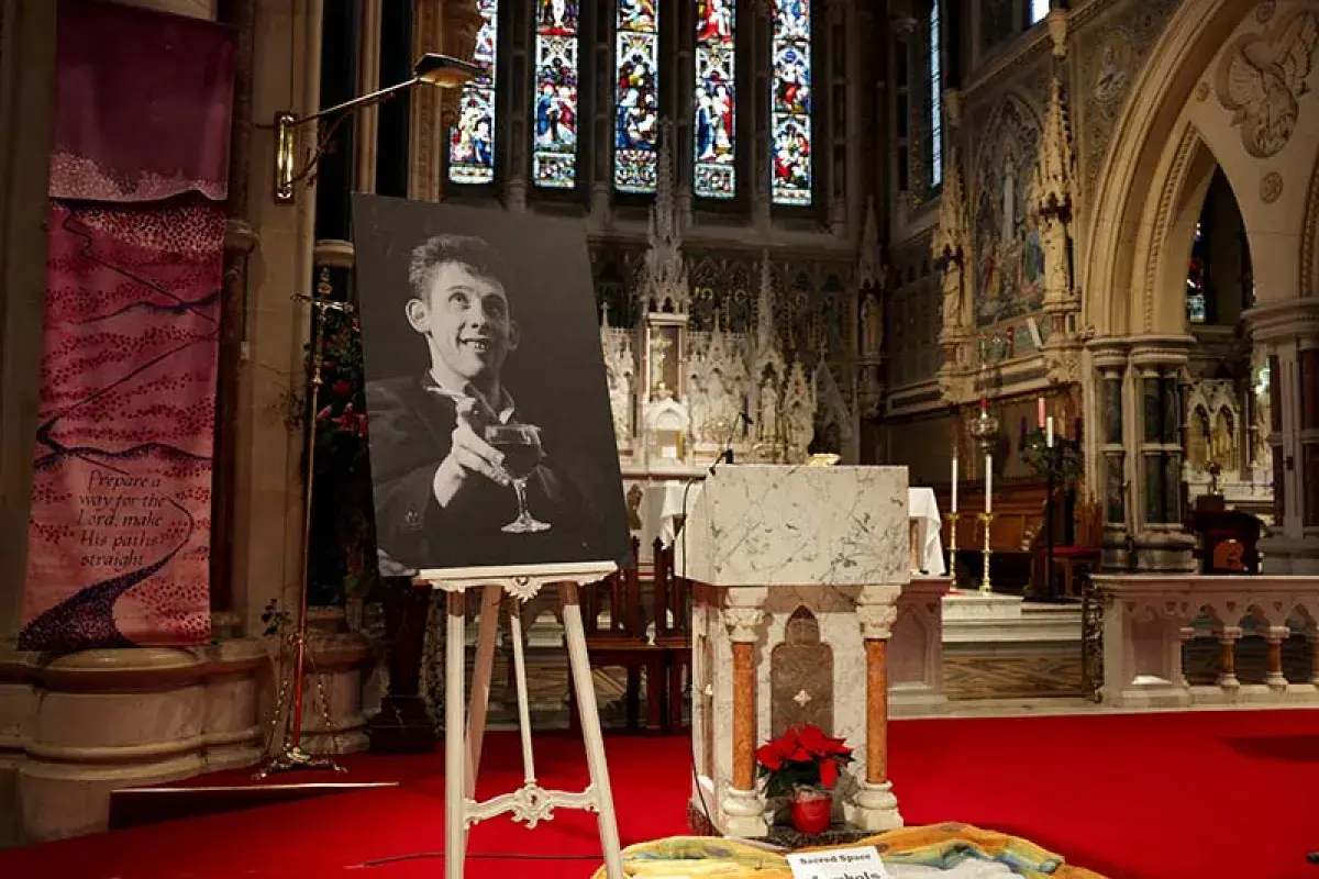 Memorial candles and a portrait honoring Shane MacGowan