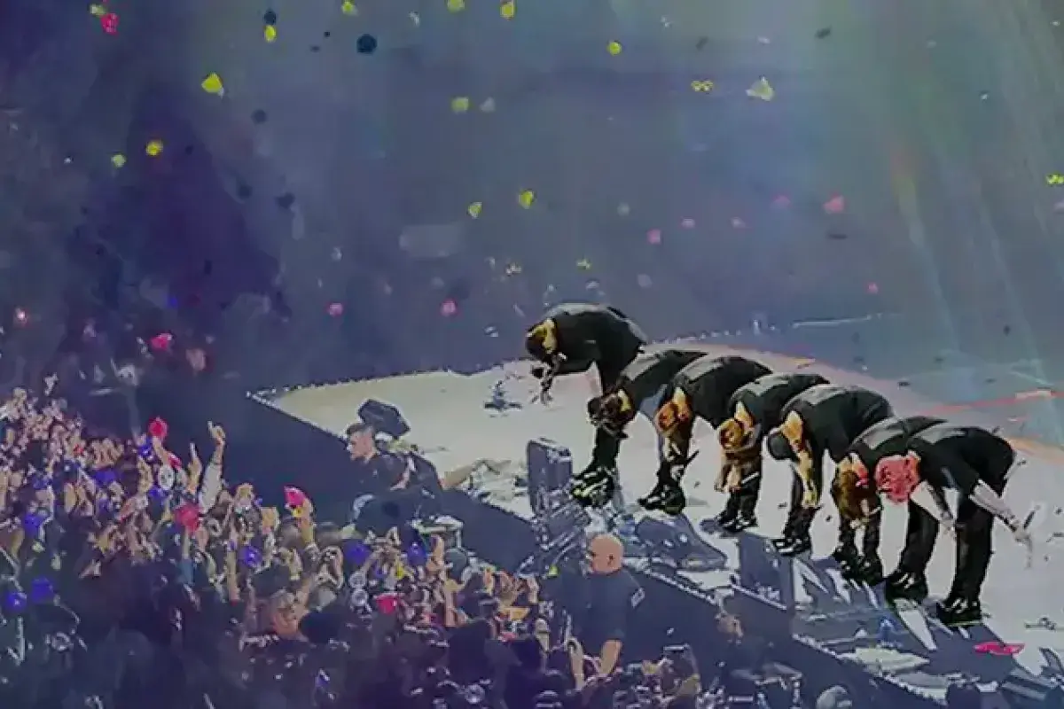 K-pop idols bowing to audience after global concert performance