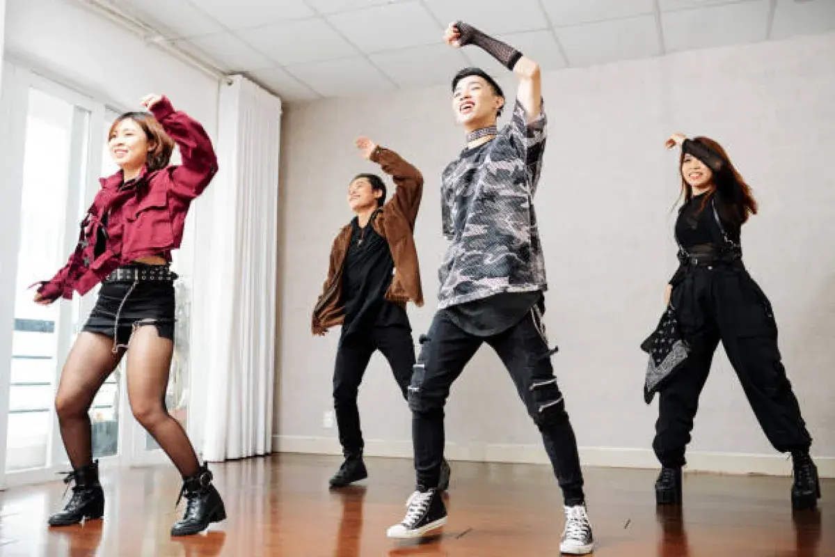  K-pop trainees rehearsing choreography in a studio mirror room
