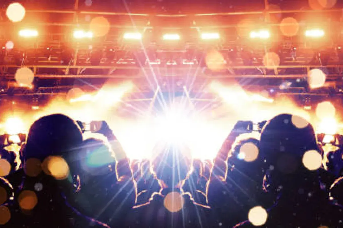 Audience waiting for a live performance with dramatic lighting
