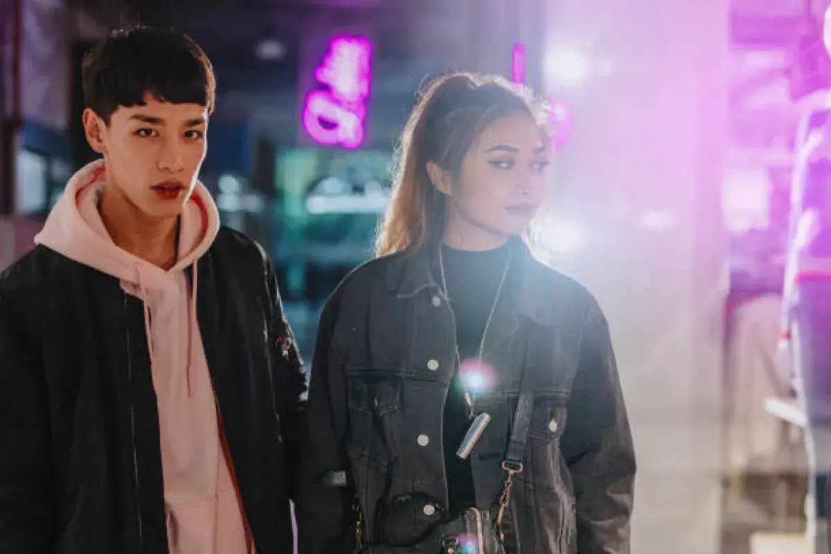  Two K-pop idols walking together representing freedom and privacy