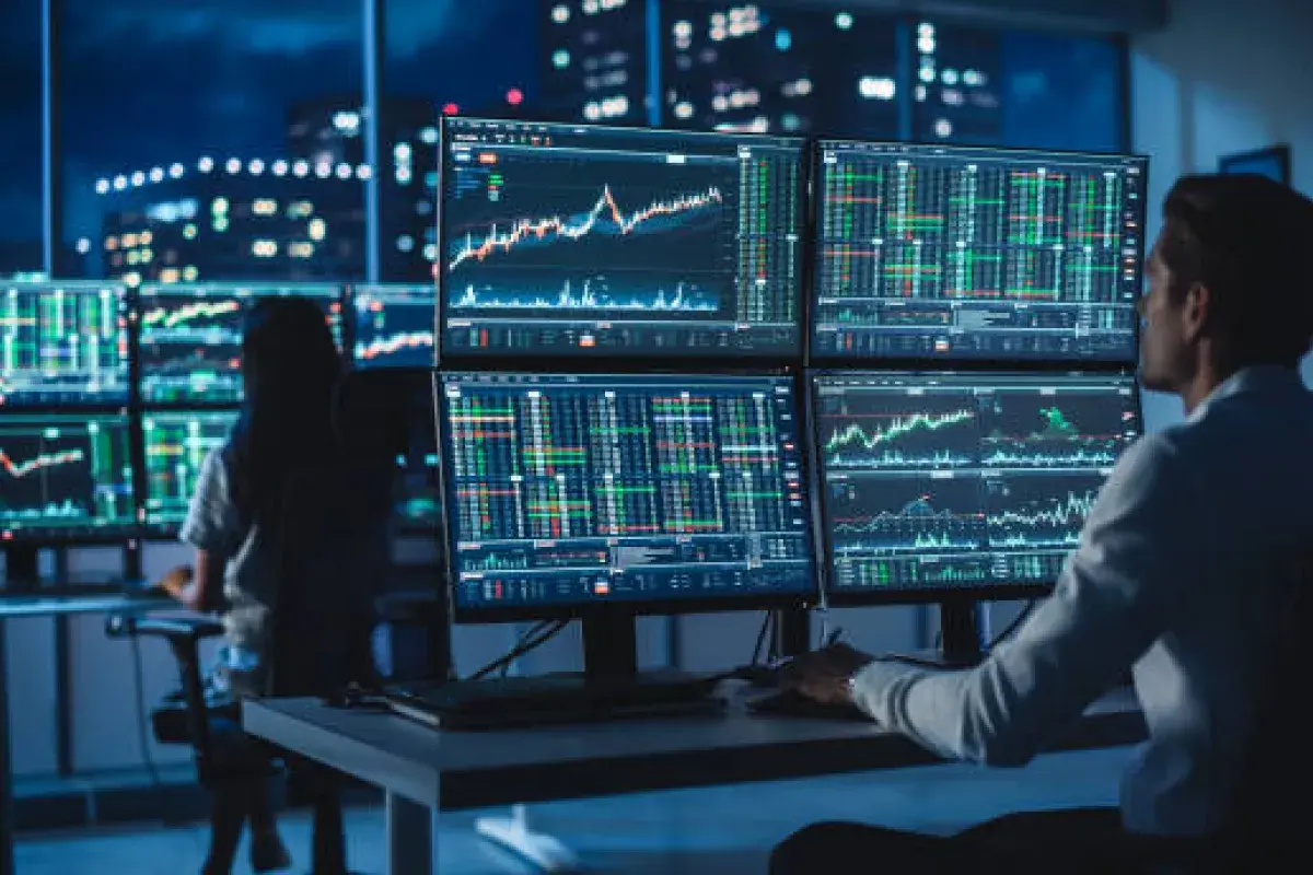Commodity traders analyzing oil market data.