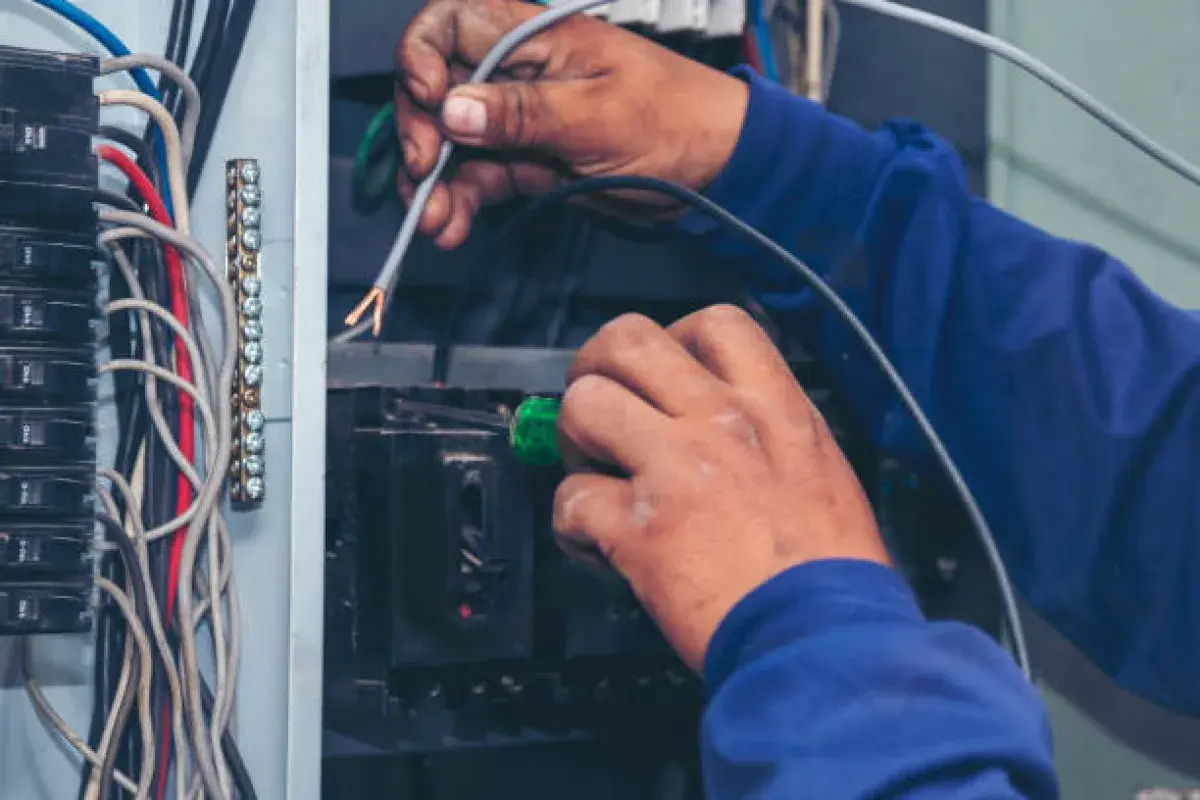 Electrician Repairing Home Electrical System]