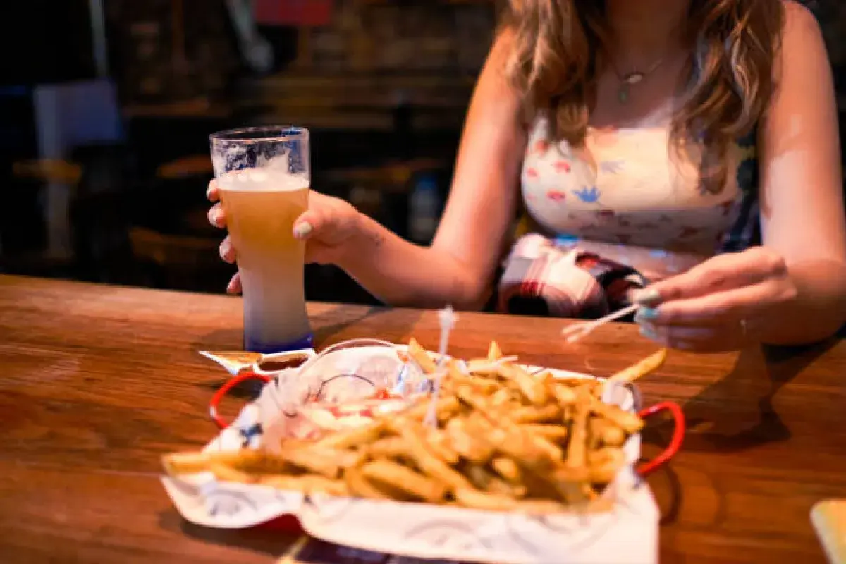 Typical American fast food meal featuring oversized drink and fries