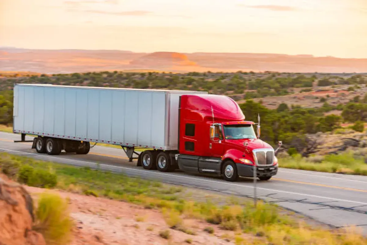 Freight Truck Driving Through American Desert Highway