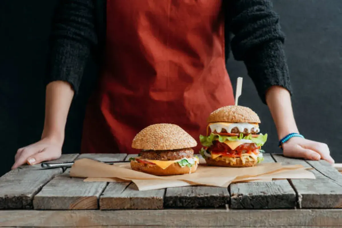 Nutritionist comparing recommended serving size to oversized American meal