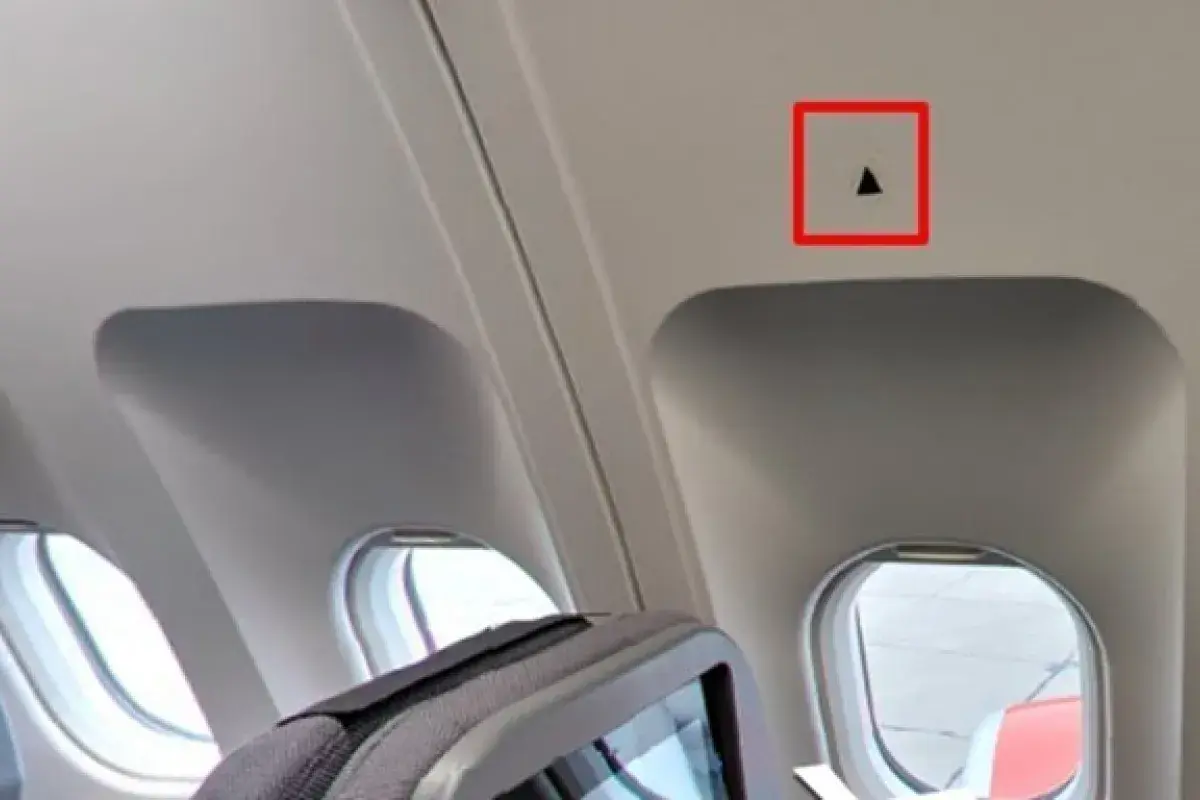 Cabin wall triangular markers above windows