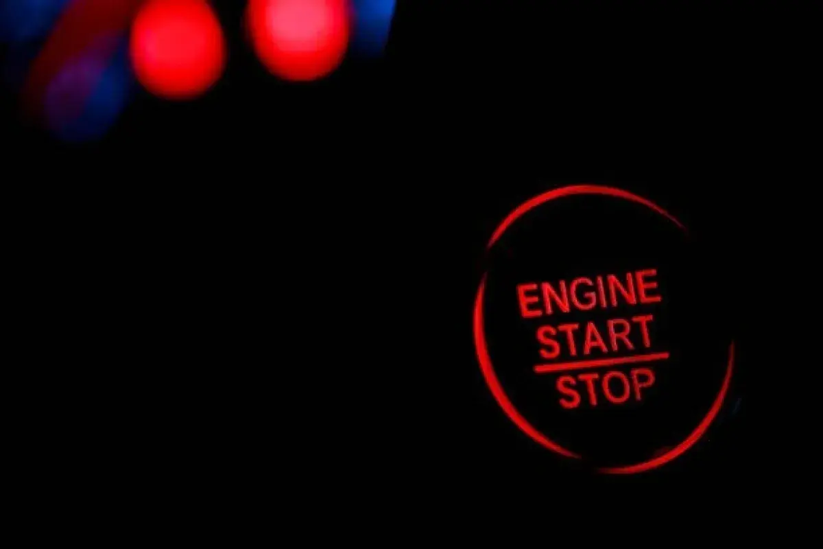 Car at red light with engine turned off to save fuel
