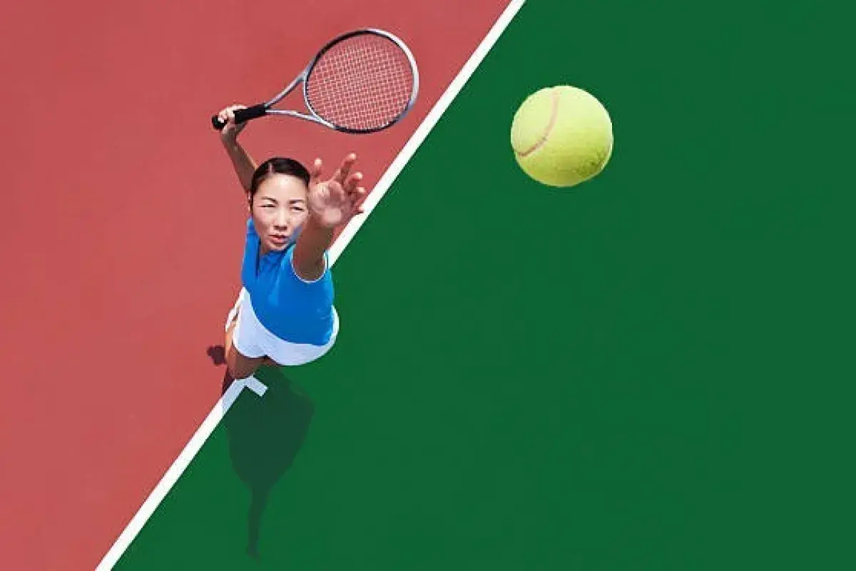 Tennis athlete serving ball on center court during major Grand Slam