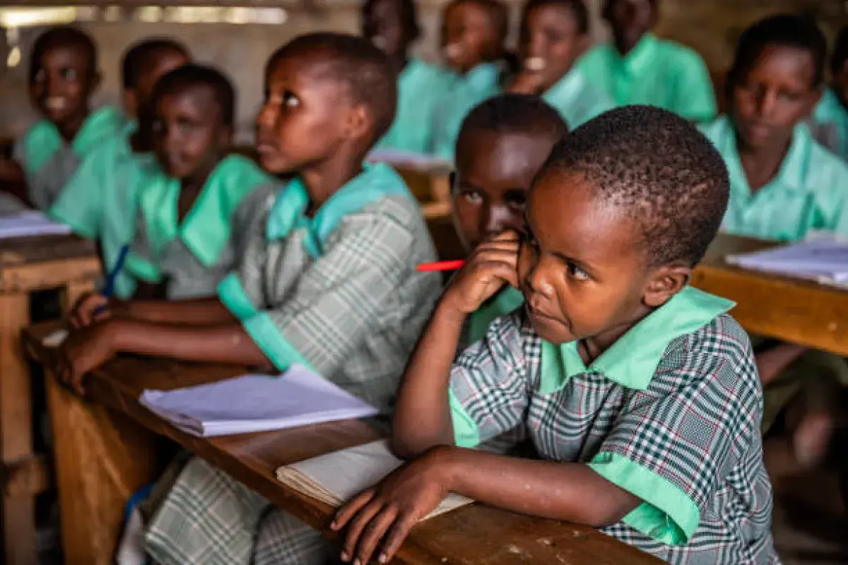 Nigerian students practicing formal classroom behavior