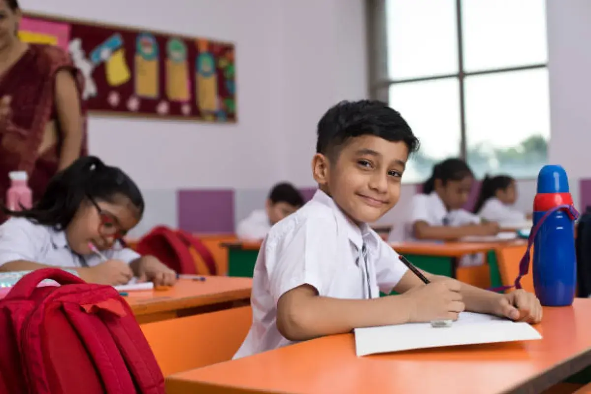 Student practicing writing skills in school