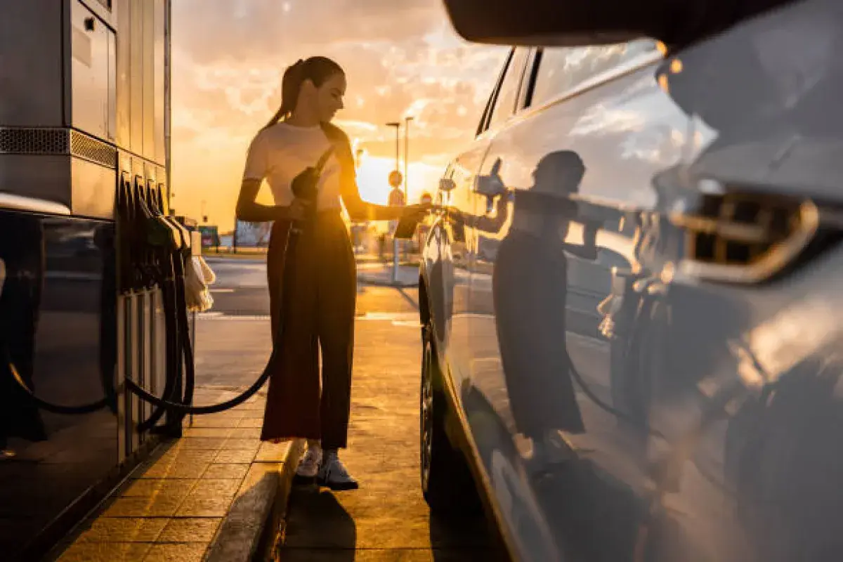 Gas station at sunrise with a car being refueled