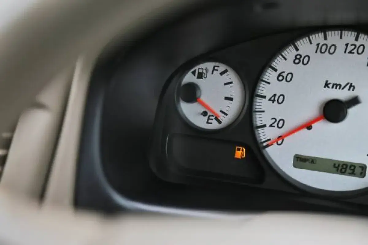 Car fuel gauge near empty