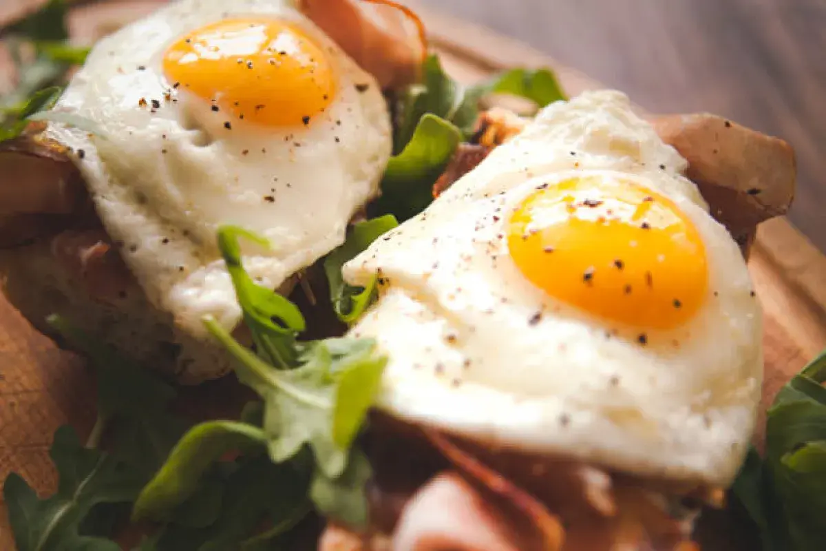 Sunnyside up eggs on salad