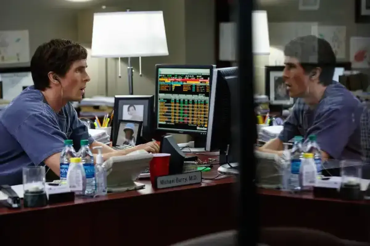 Christian Bale explaining financial charts to the camera