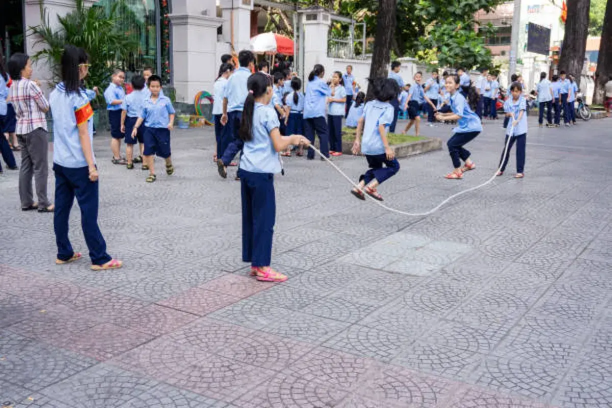 Children or community group jumping rope together with rhythm