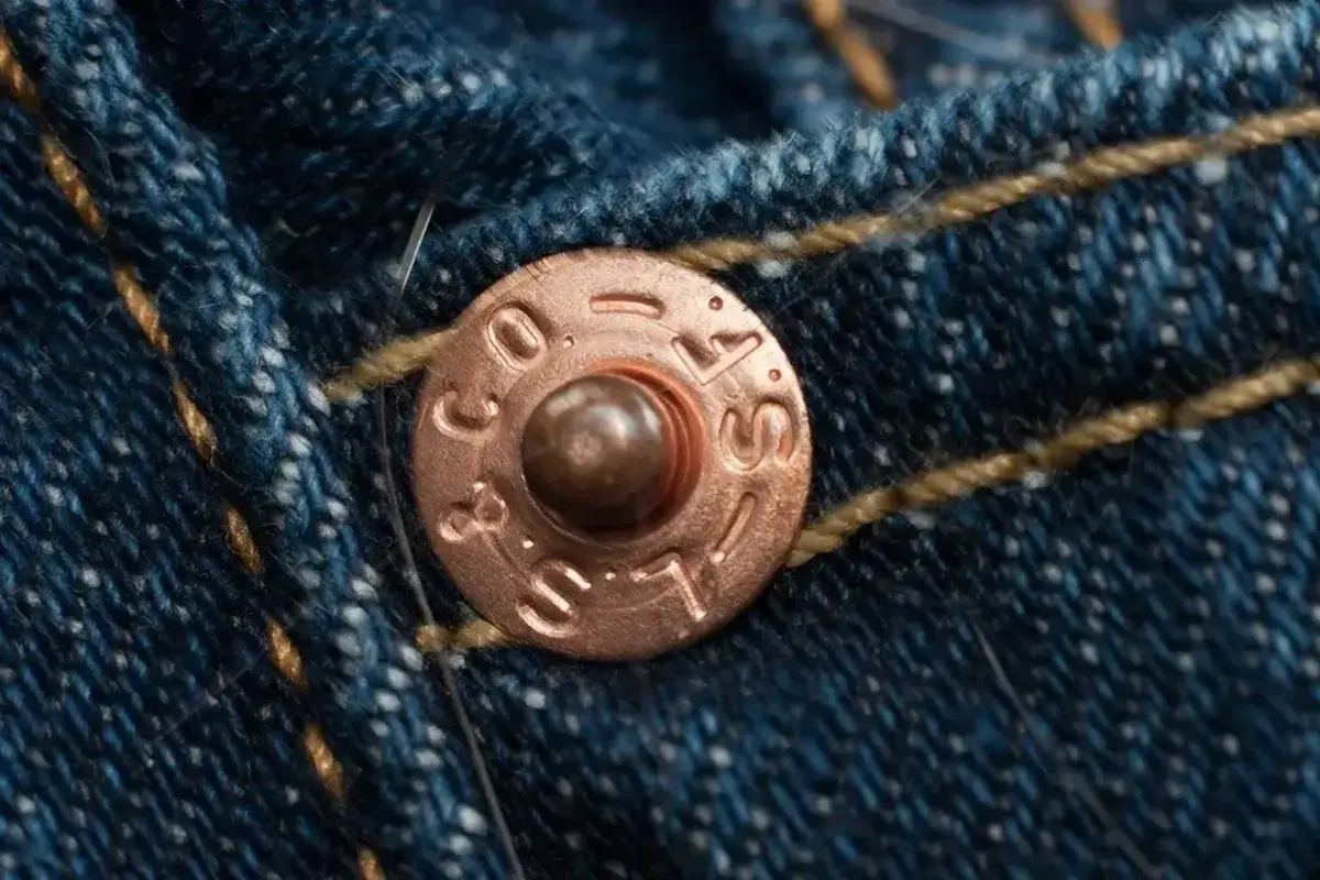 Iconic copper rivets reinforcing Levi’s jeans design