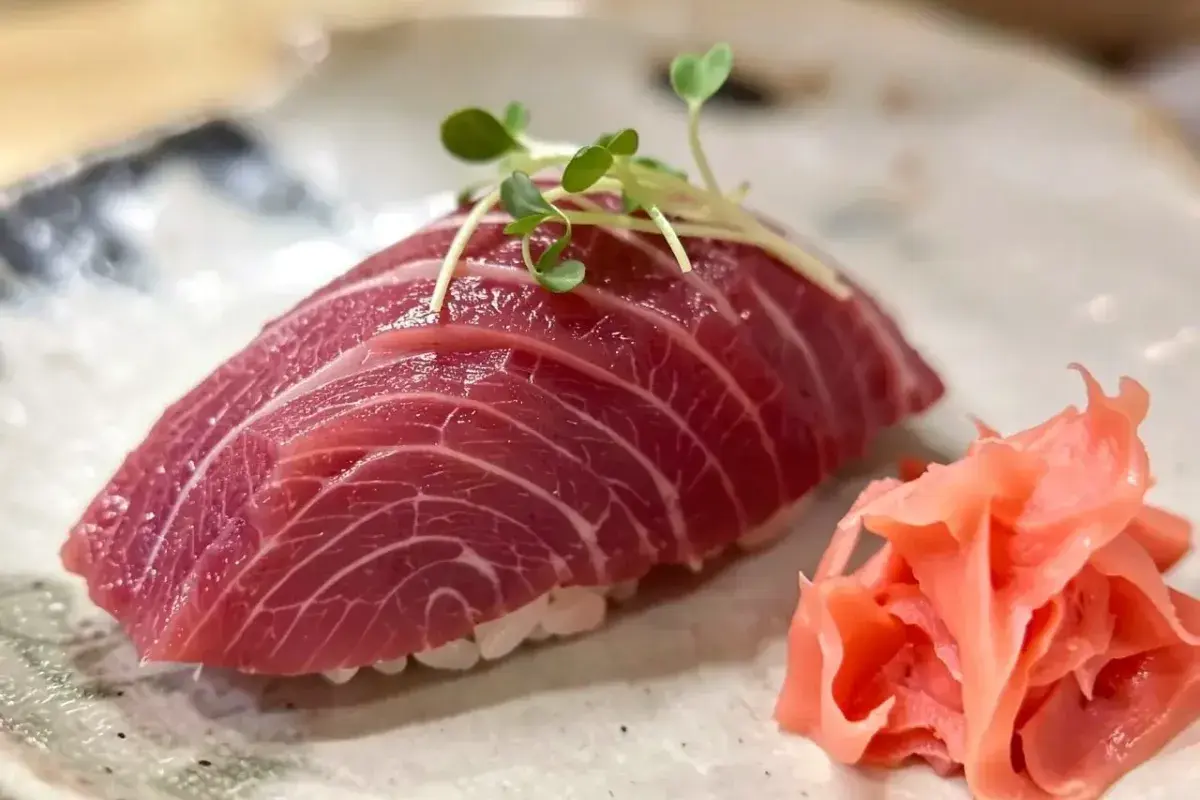 Otoro tuna nigiri with visible marbling
