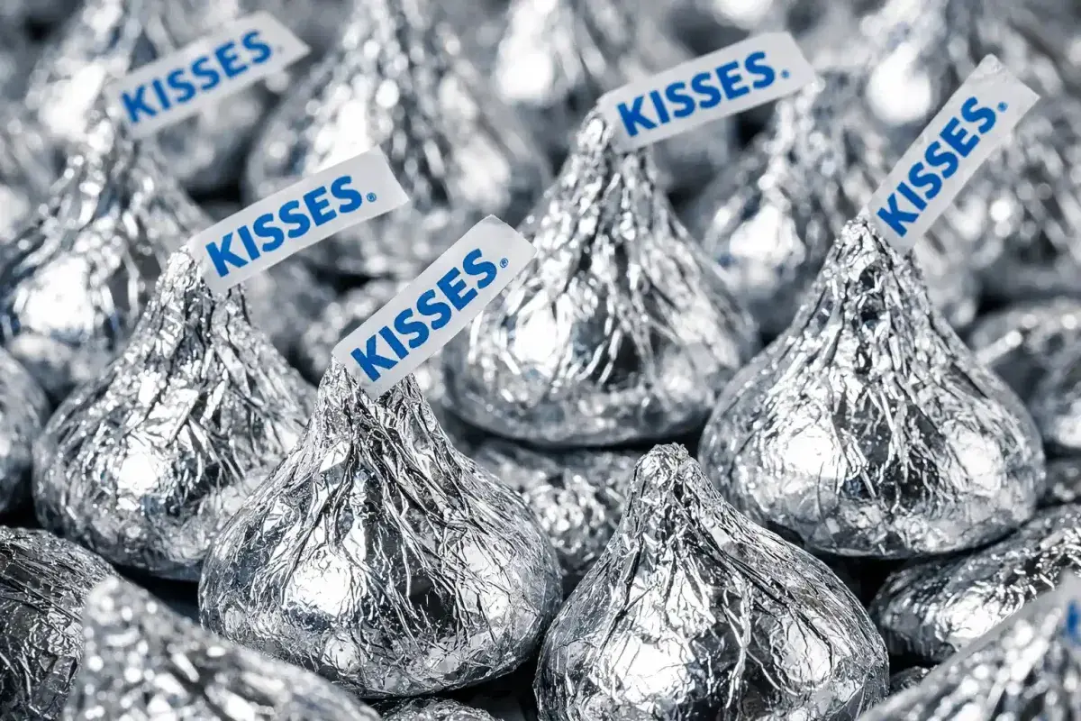 Hershey Kisses wrapped in foil with paper plumes