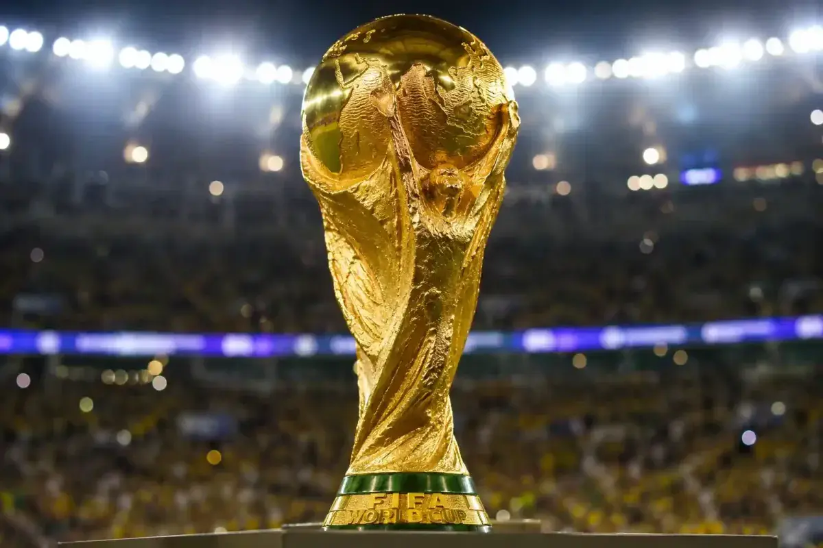 FIFA World Cup Trophy under stadium lights