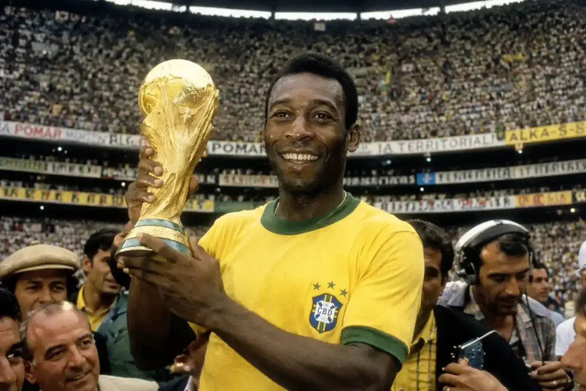 Pelé celebrating a World Cup victory with Brazil