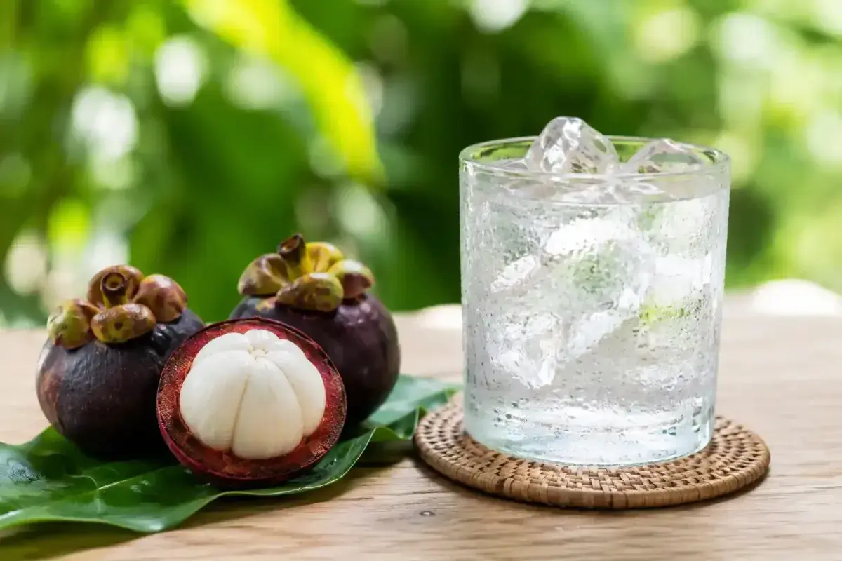 Refreshing Mangosteen Fruit Served with Cold Water and Ice