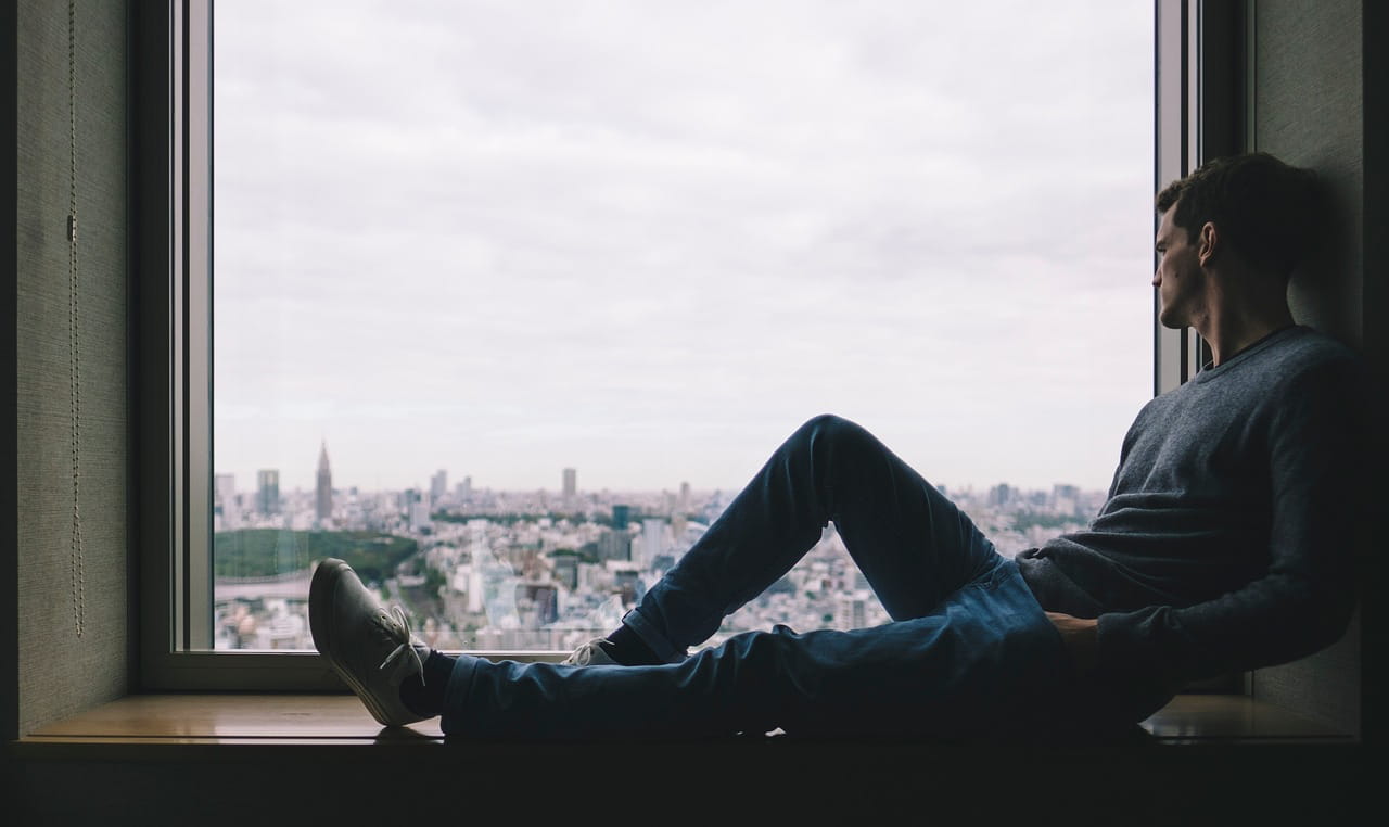 contemplating man by the window