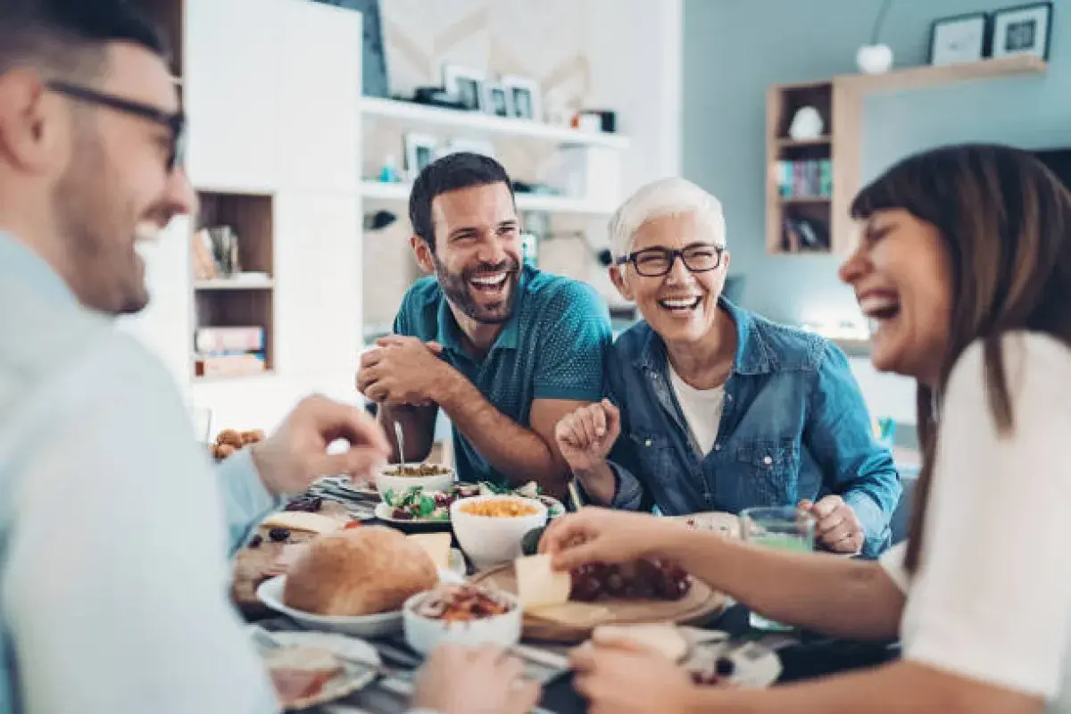 Family reconnecting through cooking and conversation.