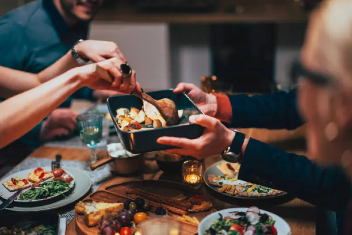 Sharing food as a gesture of connection and care.
