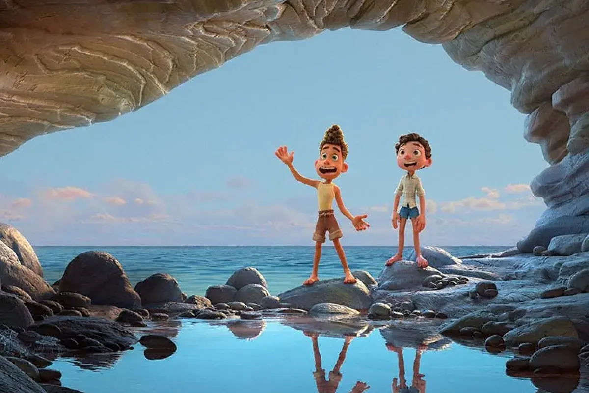 Luca and Alberto laughing together while looking at the sea