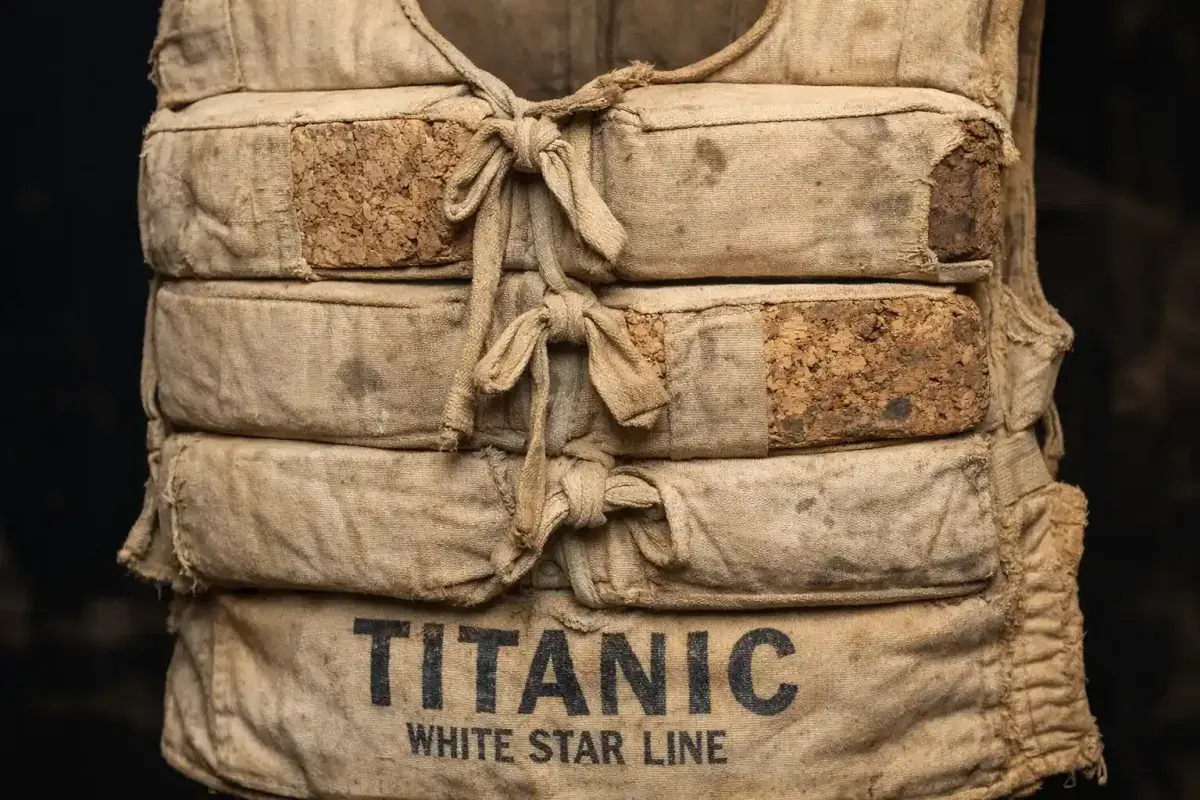 Close up of a preserved Titanic life jacket made of canvas and cork Alt title: Original Titanic life jacket preserved from the 1912 disaster