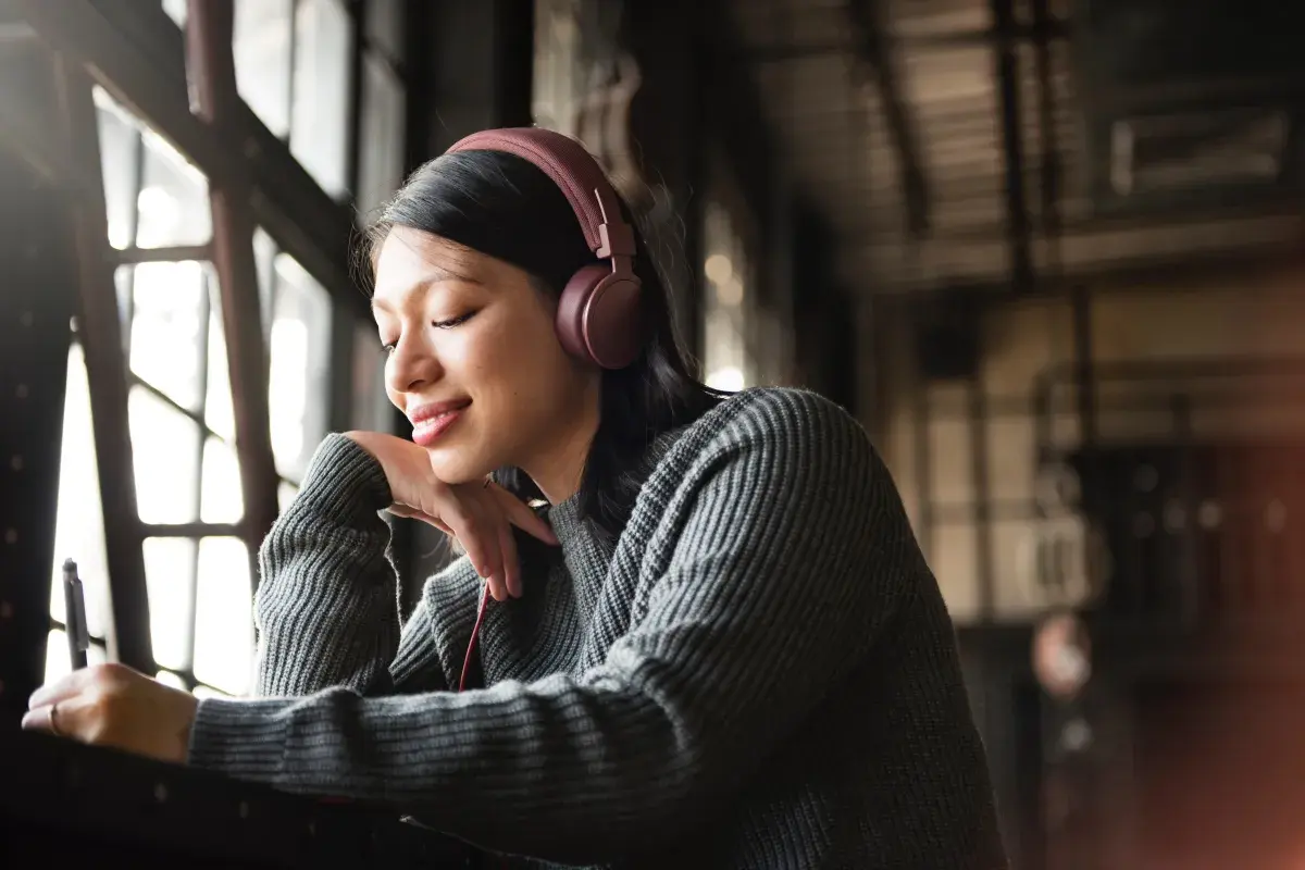 asian woman listenng to music