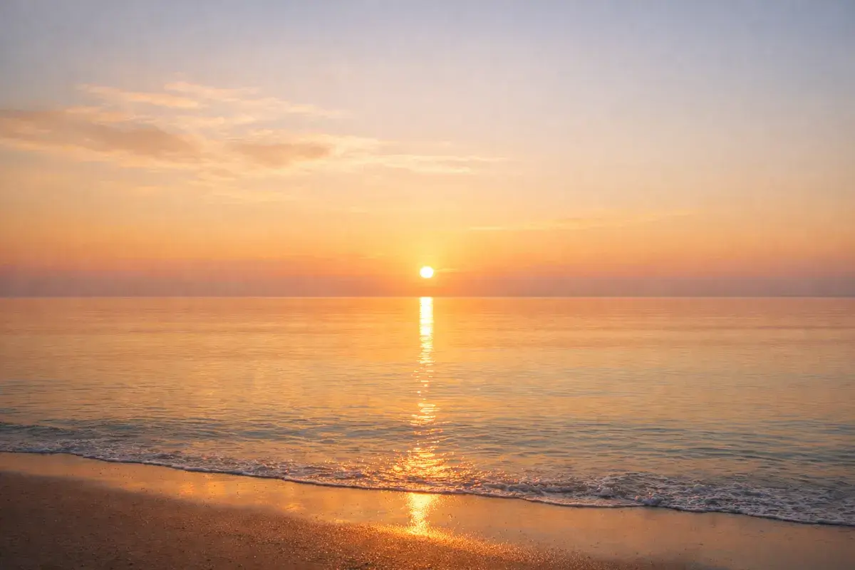 Sunrise over a calm horizon symbolizing emotional renewal and new beginning