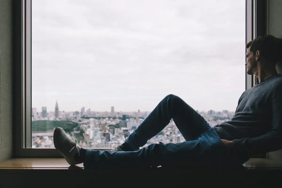 contemplating man by the window