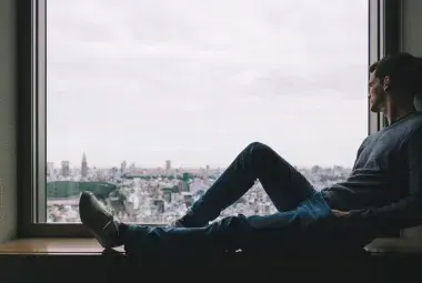 contemplating man by the window