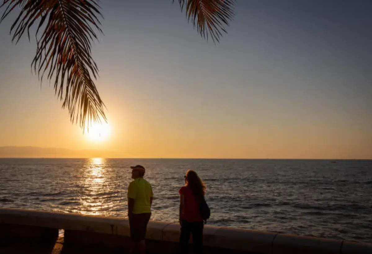 Retirees enjoying a peaceful sunset at Lake Chapala, Mexico, illustrating lifestyle and community for seniors