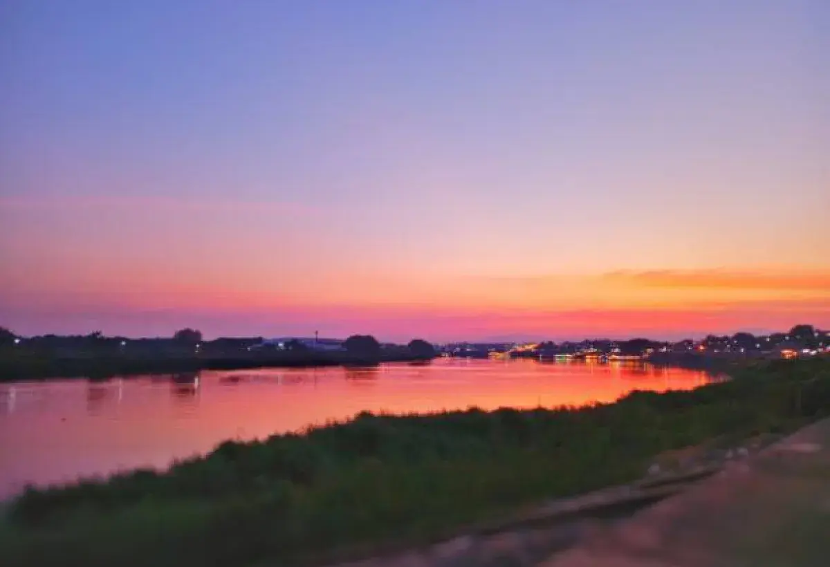 Serene lake reflecting the sky at sunset symbolizing peace and acceptance.