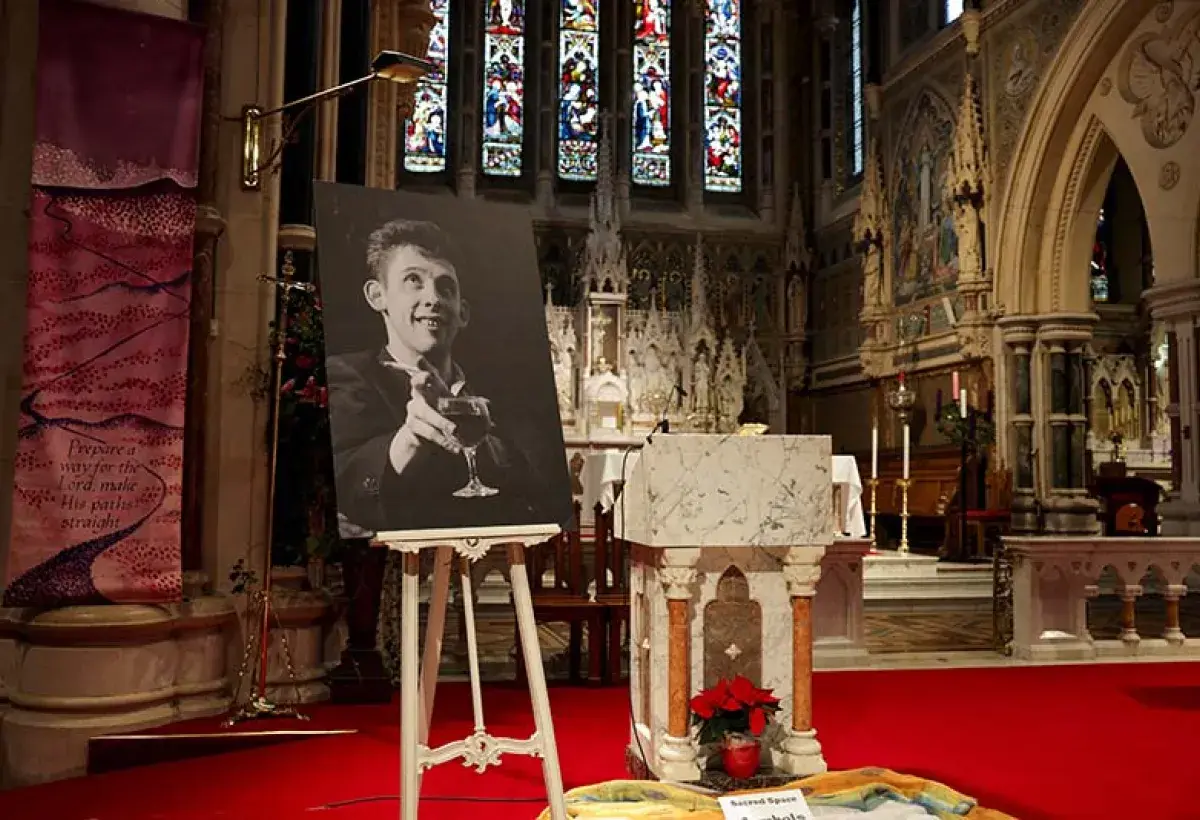 Memorial candles and a portrait honoring Shane MacGowan