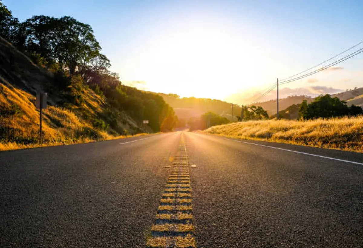  glowing road stretching into the horizon, symbolizing the journey of persistence and unending hope.