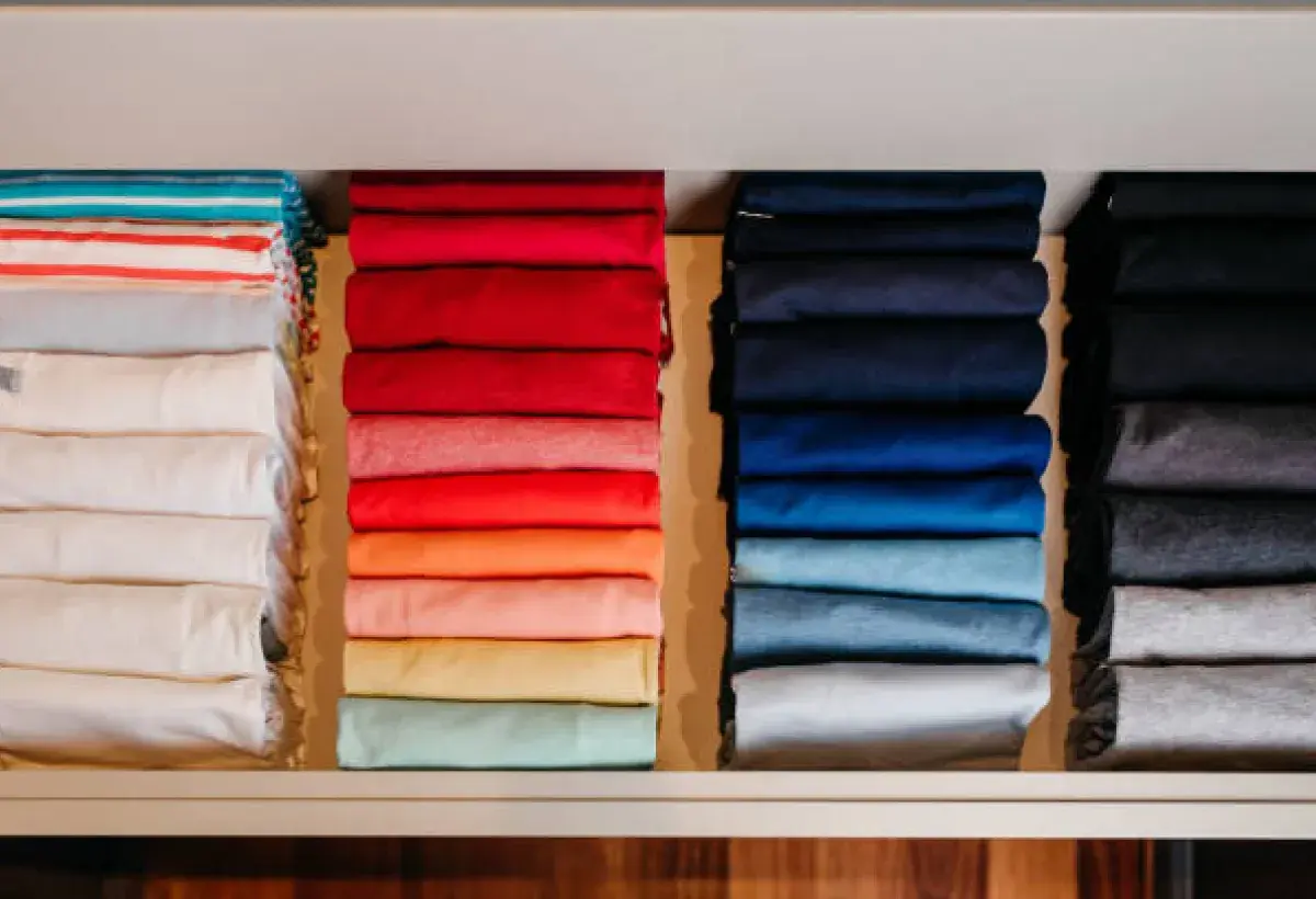 A neatly organized closet with clothes sorted by color, symbolizing peace after the feud.