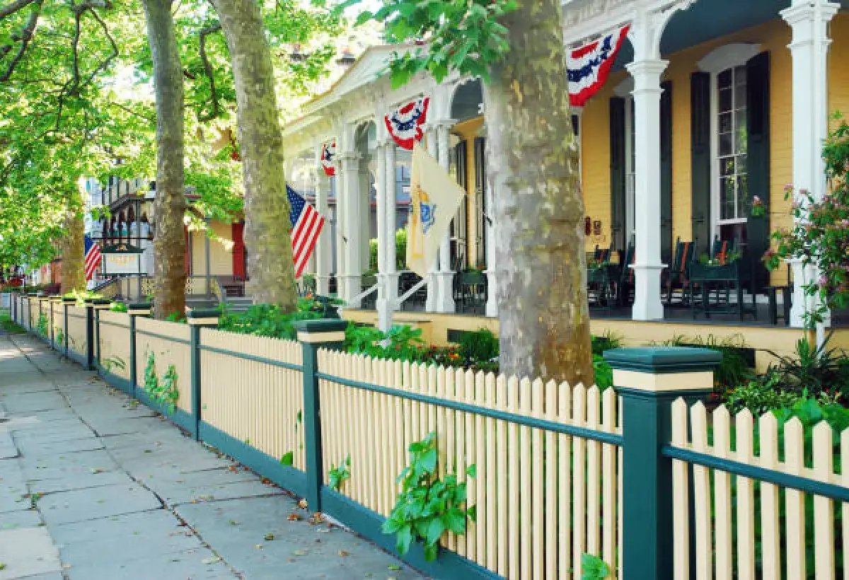 Suburban street featuring traditional wooden American houses