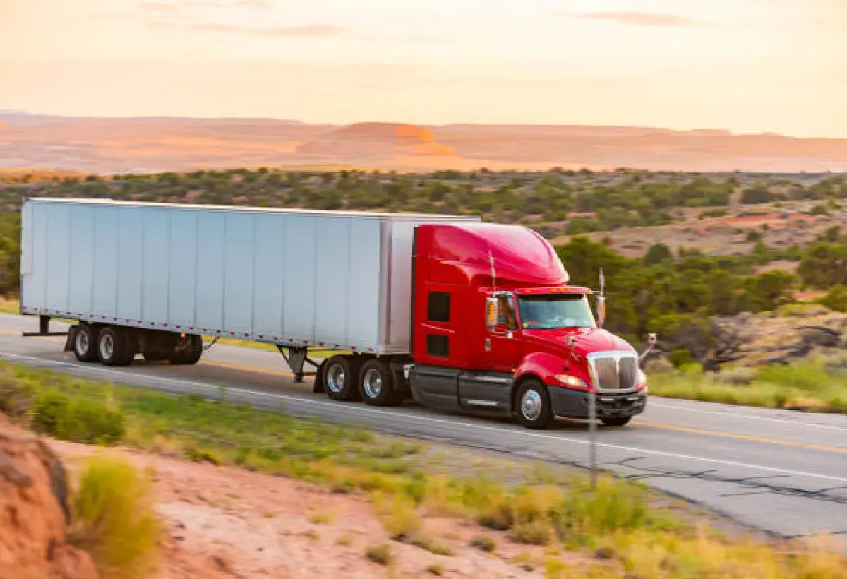 Freight Truck Driving Through American Desert Highway