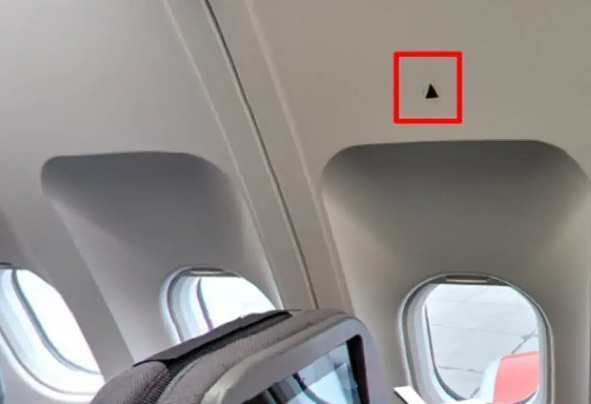 Cabin wall triangular markers above windows