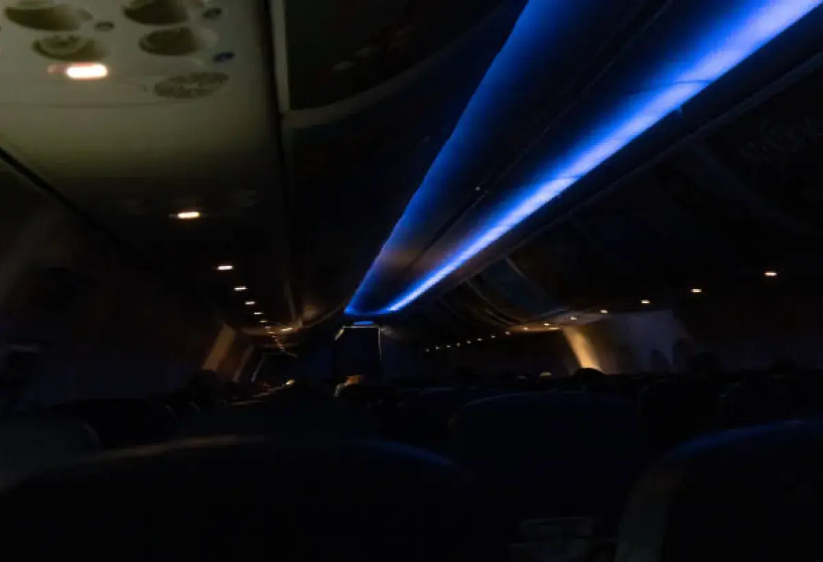 Cabin lights dimmed for nighttime landing