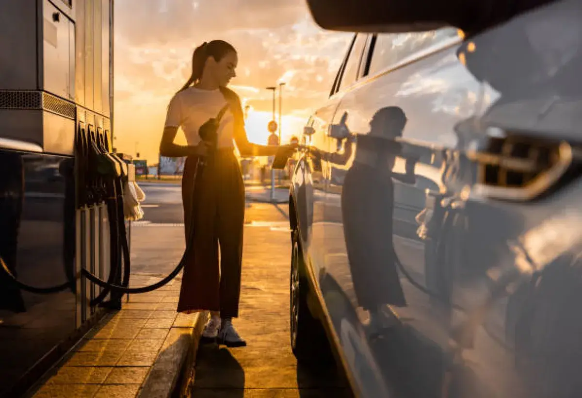 Gas station at sunrise with a car being refueled