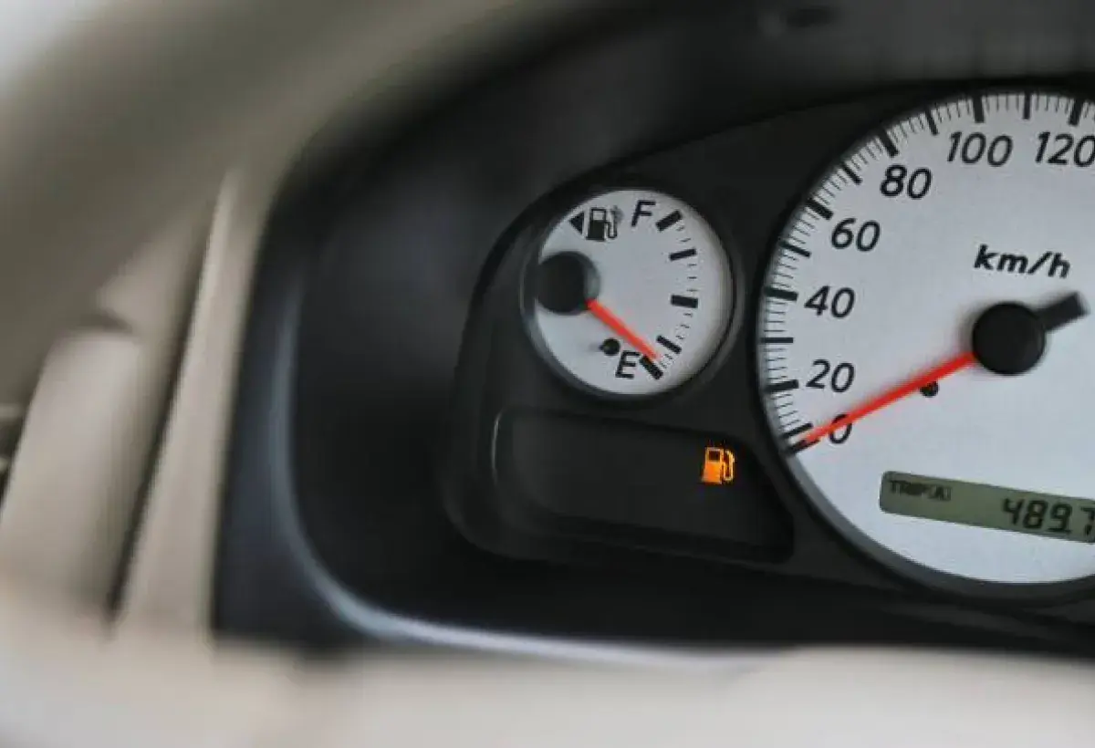 Car fuel gauge near empty