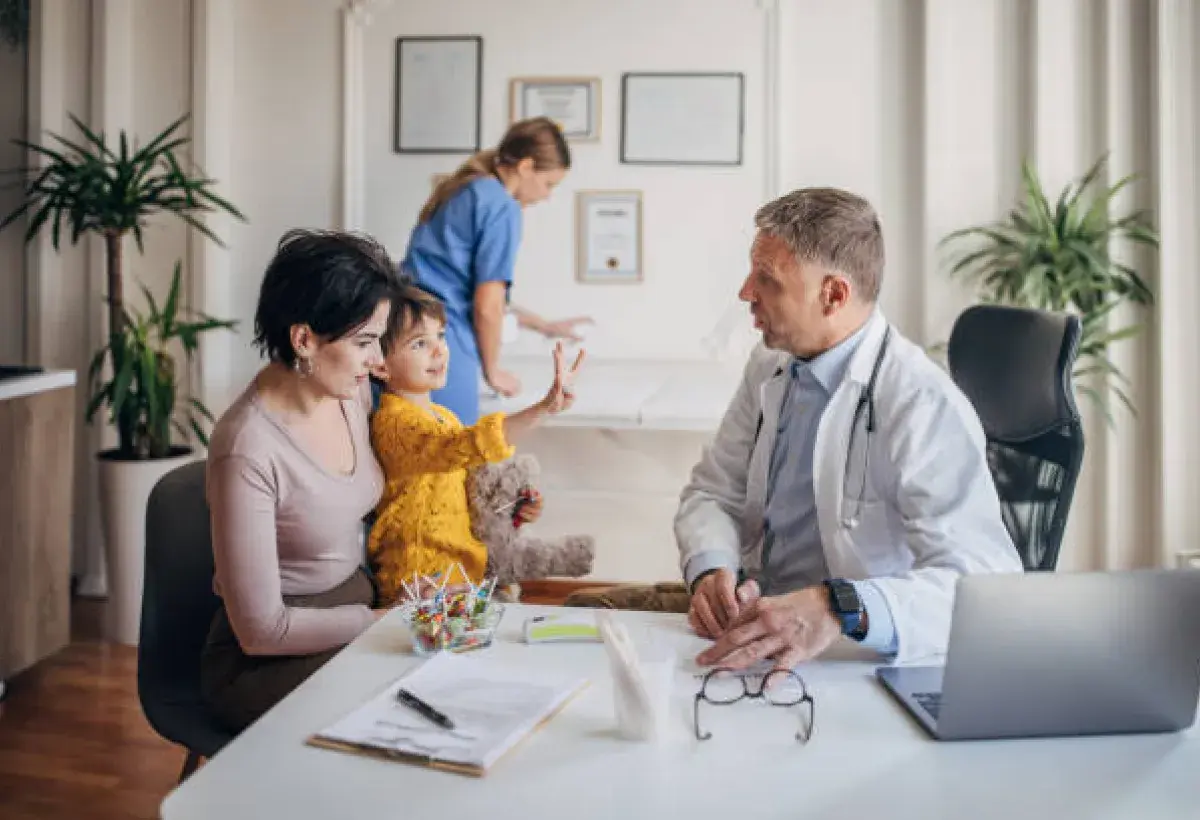 Pediatrician discussing vaccine safety with parents