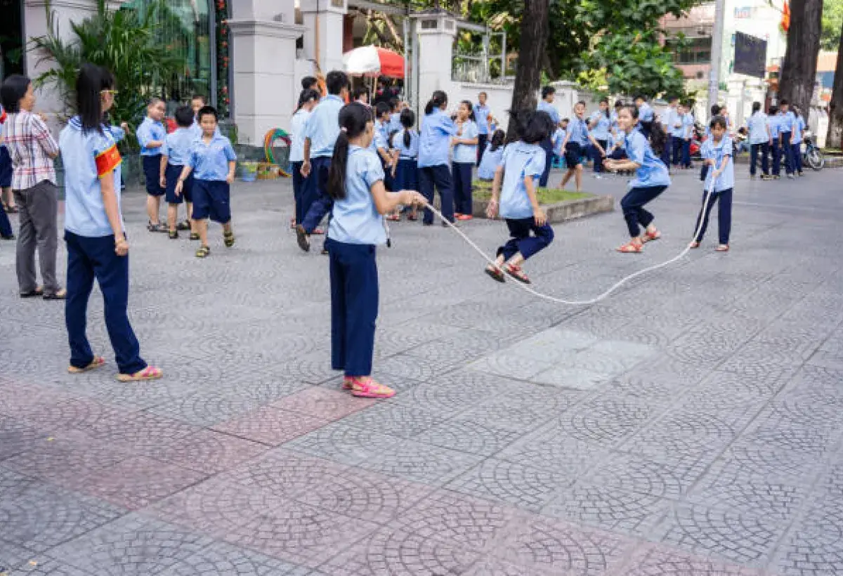 Children or community group jumping rope together with rhythm