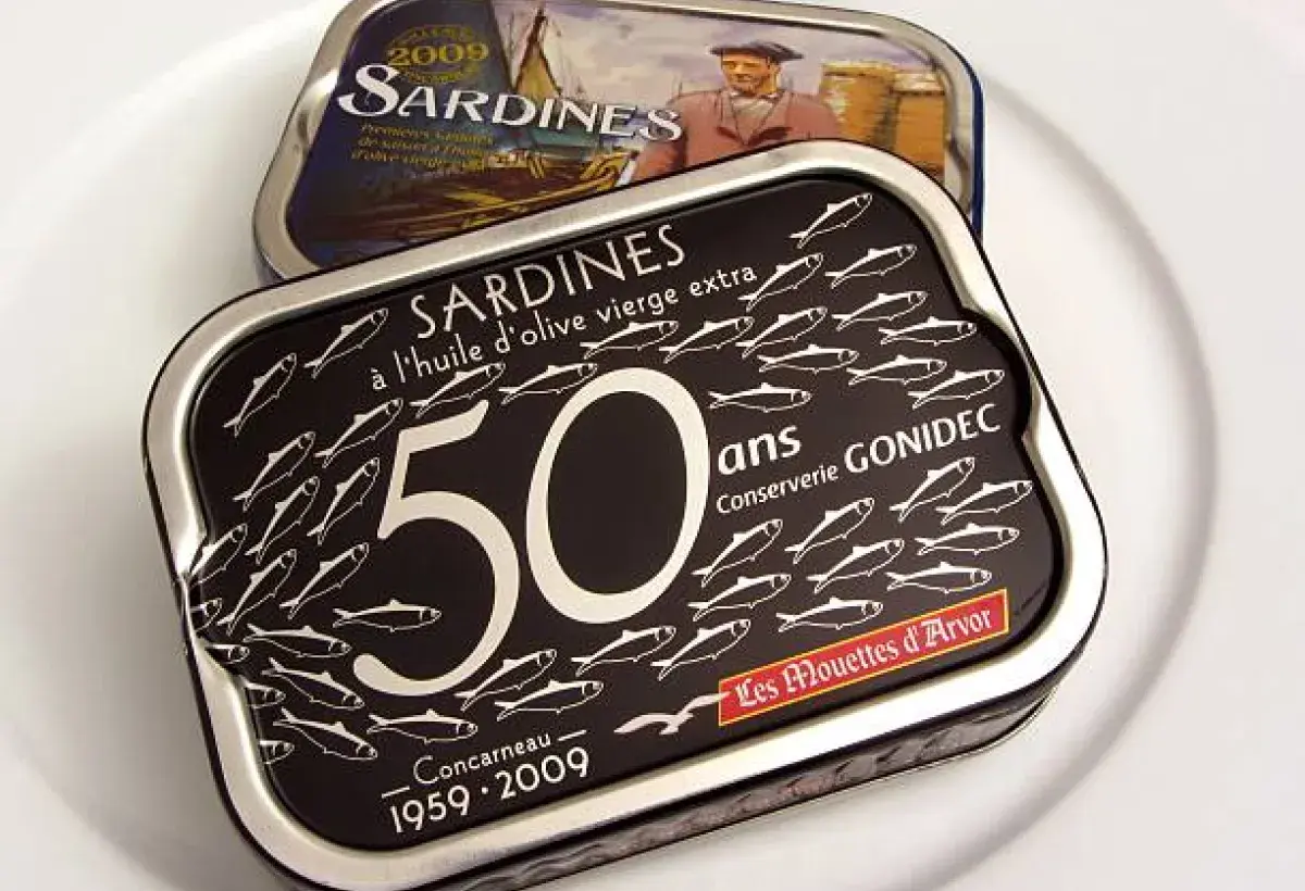 Early twentieth century sardine tins with decorative labels