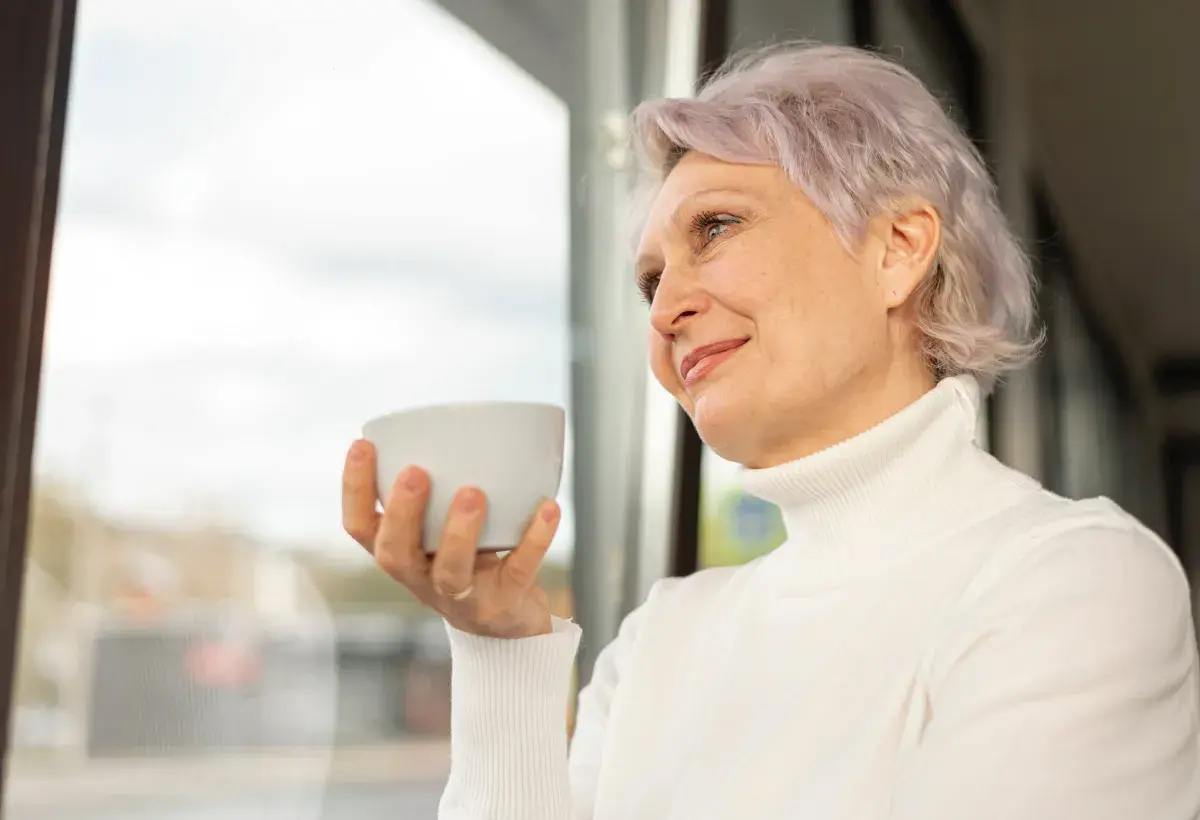 mature woman by the window